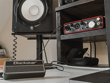 Blackstar Amplug wireless pickup on a table connected to an amplifier